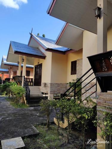 a house with solar panels on the side of it at Fueangfu Villa Chaweng in Chaweng