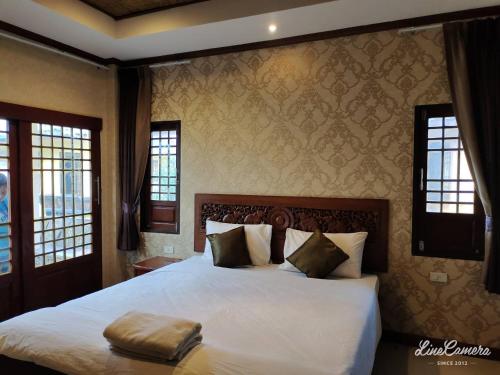 Кровать или кровати в номере Fueangfu Villa Chaweng