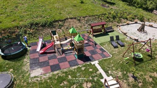 an overhead view of a playground with a slide at Casa Popescu in Călimăneşti