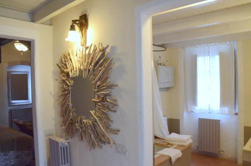 a living room with a mirror on the wall at Country house Grencaia in Chianciano Terme