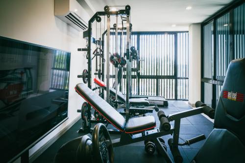 a room with a gym with a simulator at N24 Chonburi in Chon Buri