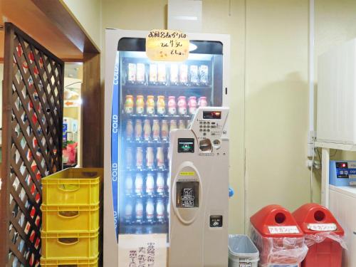 a vending machine full of water bottles in a store at ホテルスターらんど in Tsuru 