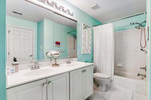 a bathroom with a sink and a toilet and a shower at Bayside Bethany Lakes --- Old Mill Way #6 in Ocean View