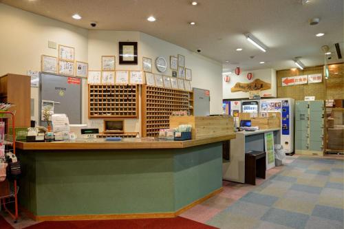 a grocery store with a counter in a room at ホテルスターらんど in Tsuru 