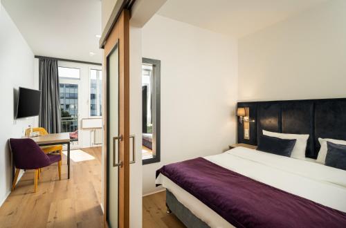 Postel nebo postele na pokoji v ubytování DIWOTEL by Trip Inn Frankfurt Airport Dreieich