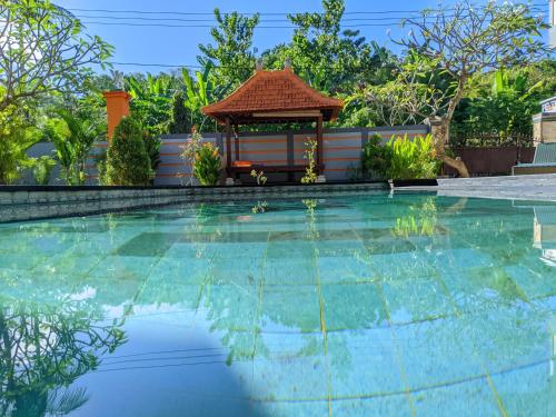 Serangan Inn Mimbaの敷地内または近くにあるプール