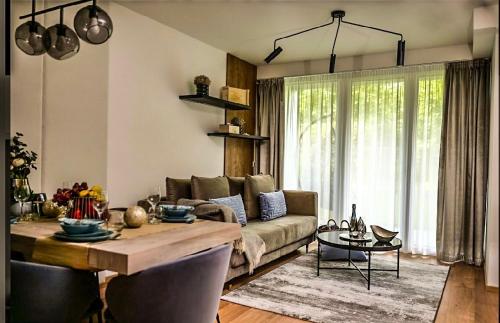 Posezení v ubytování Napfény Resort Apartman