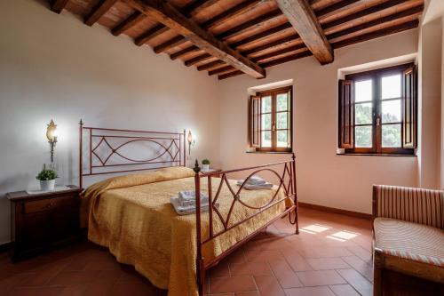 A bed or beds in a room at Melograno Poderone