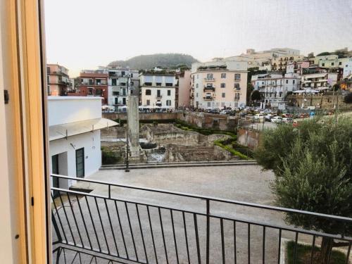 a view of a city from a balcony at B&B Historia in Pozzuoli
