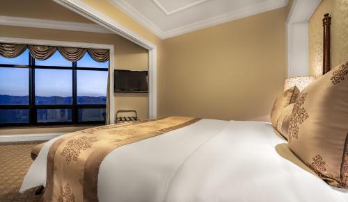 Ένα ή περισσότερα κρεβάτια σε δωμάτιο στο Green Lake Hotel