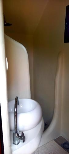 a bathroom with a sink and a toilet at Krka Magic Pumpkin in Rupe