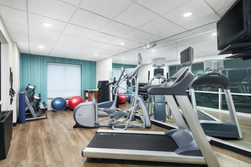 a gym with treadmills and exercise equipment in a room at Holiday Inn Express & Suites I-26 & Us 29 At Westgate Mall by IHG in Spartanburg