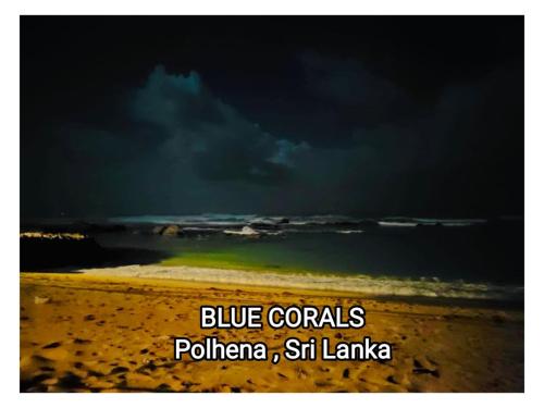 a picture of a beach with a cloudy sky and the ocean at Blue Corals Beach Bungalow in Madihe East