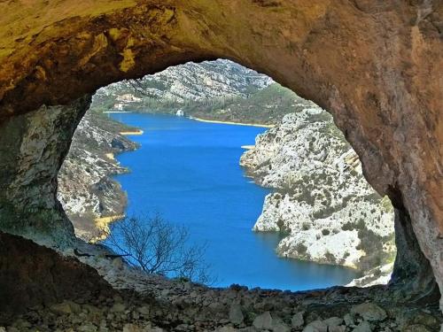 a view from a cave of a body of water at Krka Magic Pumpkin in Rupe