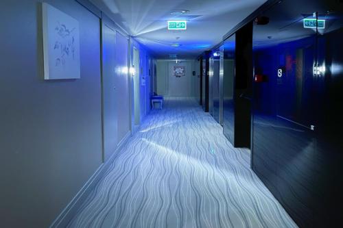 a hallway with blue lights in a room at The Conforium Hotel Van in Van