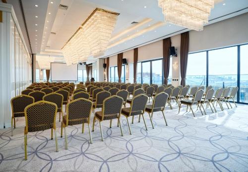 a conference room with chairs and a projection screen at The Conforium Hotel Van in Van