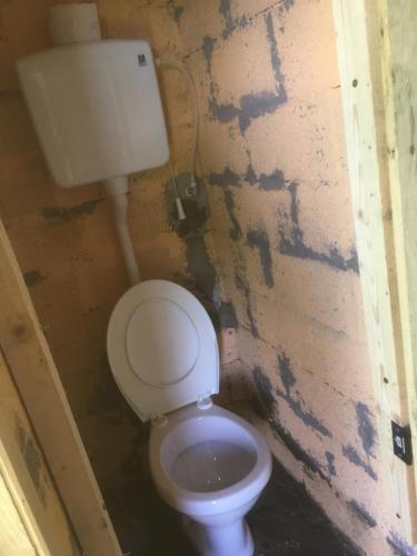 a small bathroom with a white toilet in a room at Ambar in Nova Varoš