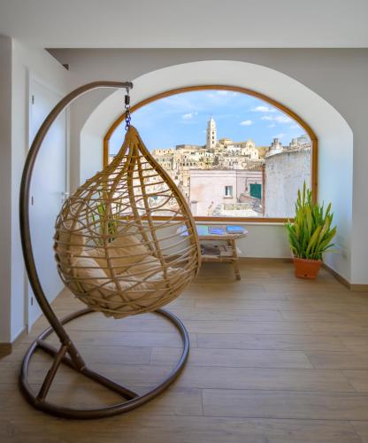 a basket on a stand in a room with a window at The View Matera in Matera