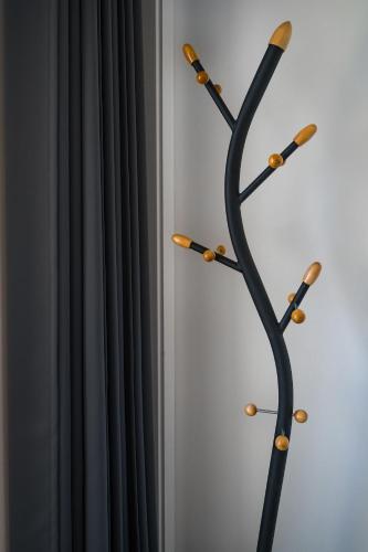 a black curtain next to a wall with wooden hoops at The View Matera in Matera