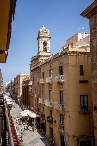 a view of a building with a clock tower at La Loggia di Trapani in Trapani