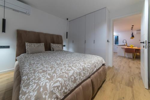 Postel nebo postele na pokoji v ubytování Zitab Luxury Apartment