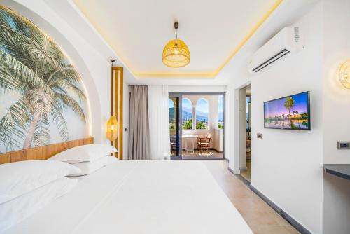 1 dormitorio con 1 cama blanca grande en una habitación en Drossia Residenza Boutique Hotel Malia en Mália