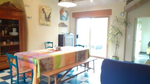 a room with a table with a colorful table cloth at Maison de 3 chambres avec jardin clos et wifi a Mouzillon in Mouzillon