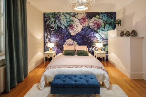 Un pat sau paturi într-o cameră la L'Anjépie