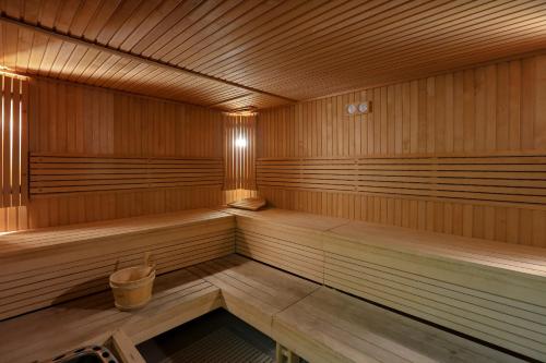 a empty sauna with a trash can in it at Mövenpick Hotel City Star Jeddah in Jeddah