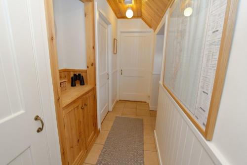 a hallway with a large map on the wall at Cuir na Bhoir in Clachan