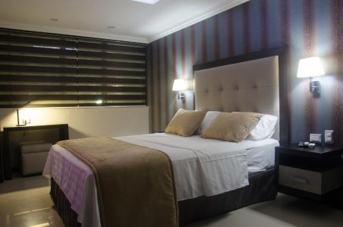 Postel nebo postele na pokoji v ubytování Hotel Veuxor