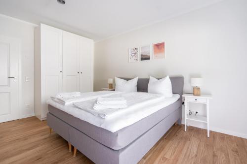 Ένα ή περισσότερα κρεβάτια σε δωμάτιο στο Burghof Apartments Hoyerswerda