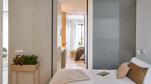 a bedroom with a bed with a book on it at 60 Balconies Iconic in Madrid
