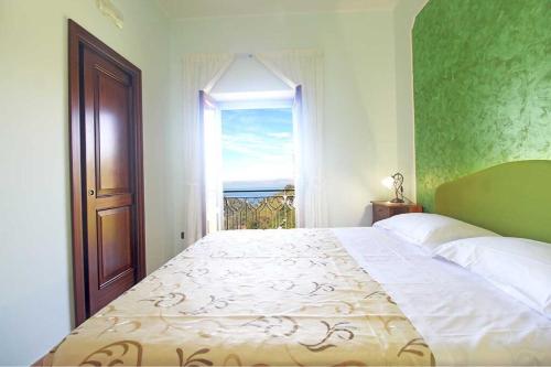 מיטה או מיטות בחדר ב-Casa Vacanza Puntaferano