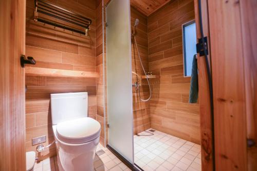 a bathroom with a toilet and a shower at Min-sheng Art homestay in Tainan