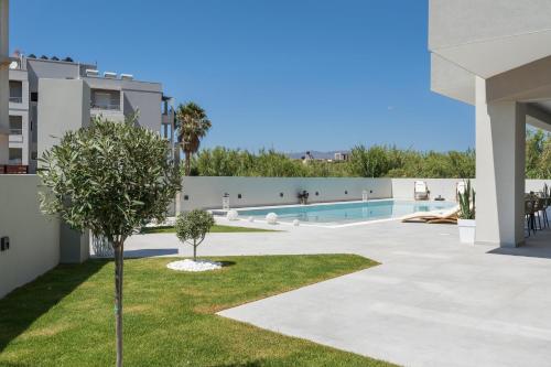 a view of the pool from the backyard of a apartment at Kallistefan in Kissamos