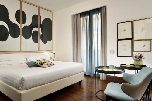 Postel nebo postele na pokoji v ubytování Hotel Pulitzer