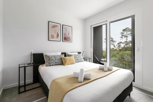Postelja oz. postelje v sobi nastanitve Nazaré Sea View Apartment