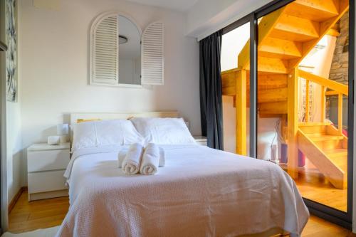 a bedroom with a bed with two towels on it at Holiday Home Wellspring in Jastrebarsko
