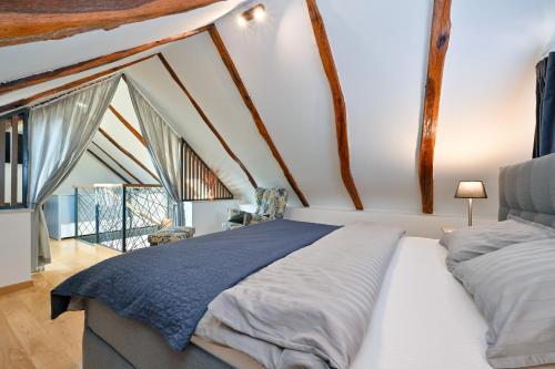 A bed or beds in a room at Florek & Florica Kalnik