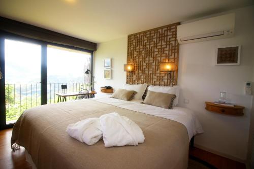 Postel nebo postele na pokoji v ubytování Casa do Tempo Geres