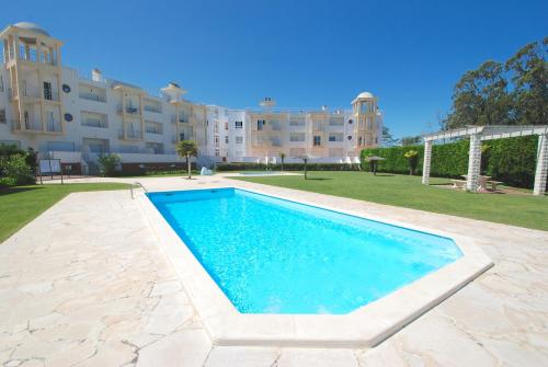 a swimming pool in front of a building at Turtle - 3 bedroom apartment in Nazaré with 2 shared pools and private terrace in Nazaré