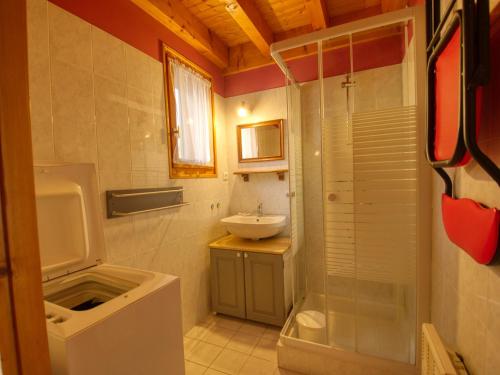 a bathroom with a shower and a sink and a toilet at Chalet Morillon Village, 3 pièces, 7 personnes - FR-1-642-42 in Morillon