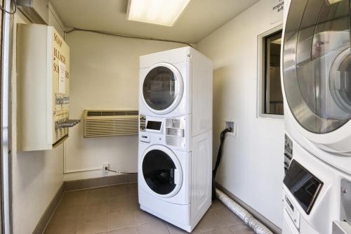 a laundry room with a washer and dryer at Motel 6-Pendleton, OR in Pendleton