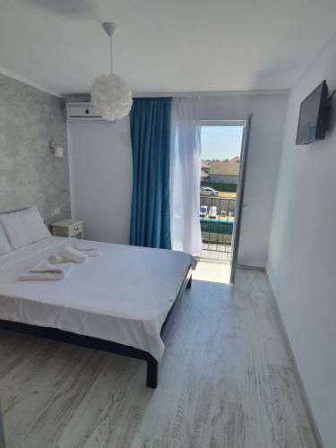 Ένα ή περισσότερα κρεβάτια σε δωμάτιο στο Vila OK