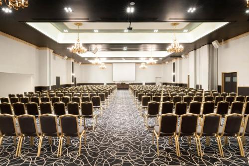 an empty room with rows of chairs in it at Grand Hotel Palace in Thessaloniki