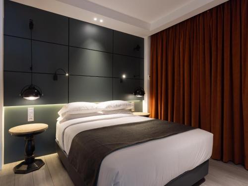 a bedroom with a large bed with a black headboard at PillowAbroad - Médano B in El Médano