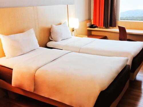 Cama o camas de una habitación en Ibis Padang