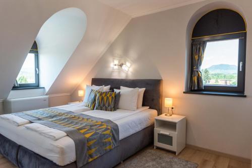 Кровать или кровати в номере Katzer Villa