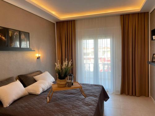 Hotel Valerios tesisinde bir odada yatak veya yataklar